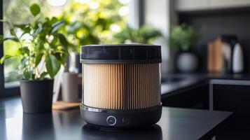A black and white air purifier sitting on a counter photo