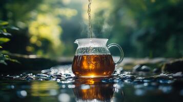 A pitcher of tea is being poured into a stream photo