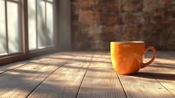 An orange coffee mug sits on a wooden floor photo