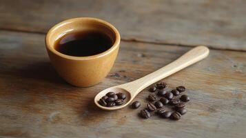 Coffee beans and spoon on wooden table photo