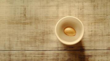 An egg in a bowl on a wooden table photo