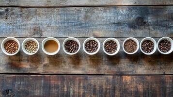 Coffee beans in different sizes on a wooden table photo
