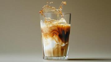 An iced coffee with a splash of liquid photo