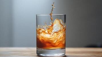 A glass of coffee with liquid splashing into it photo