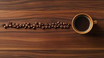 Coffee beans and cup on wooden table top view photo