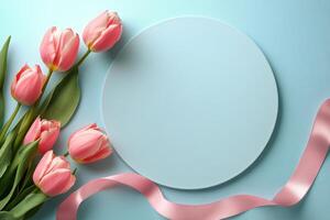 Floral arrangement with pink tulips and ribbon on a pastel background for creative designs photo