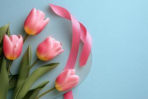 Floral arrangement with pink tulips and ribbon on a pastel background for creative designs photo