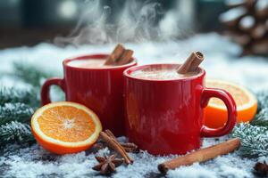 Warm drinks with spices and oranges in a snowy winter setting photo