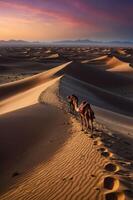 A serene desert landscape at sunset with camels walking along the sandy dunes. photo