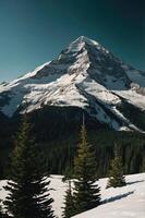 A majestic snow-capped mountain rises above a forest of evergreen trees under a clear sky. photo