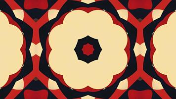 A symmetrical pattern featuring a flower design with orange petals and a black background. video