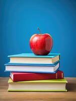 Red apple on stack of books photo