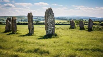 Mysterious standing stones in a lush green field photo