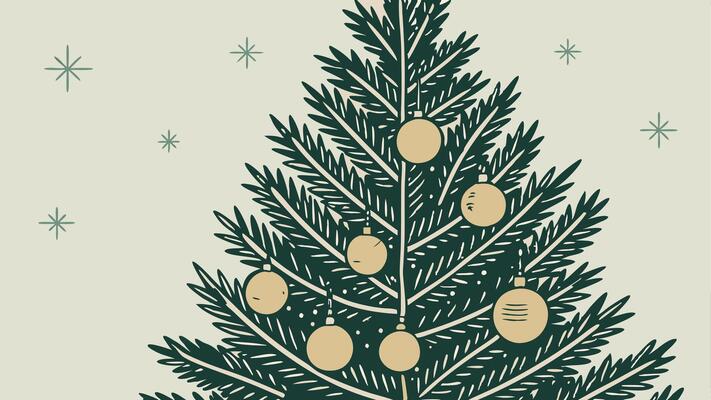 A christmas tree with gold ornaments and a blurry background.