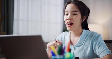 Female freelancer enjoying call with team members via laptop in home office. Working from home, Remote working. video