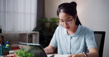 Footage of handheld, Female freelancer having call meeting with team and presenting project via digital tablet in home office. Work from home ,Remote work video