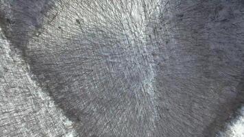 View from the drone vertically down to the winter mountain steeped by the forest video