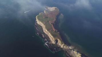 Drone view of a beautiful peninsula Tobizina with vertical cliffs at sunrise video