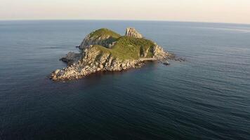 Rocky islands in Triozerye bay at sunset. Drone view at night video