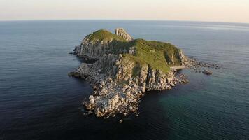 Rocky islands in Triozerye bay at sunset. Drone view at night video