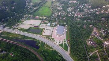 Drone view of the Fetisov Arena sports complex, surrounded by green hills video