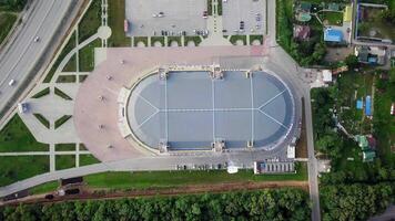 Drone view of the Fetisov Arena sports complex, surrounded by green hills video