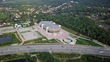 Drone view of the Fetisov Arena sports complex, surrounded by green hills video