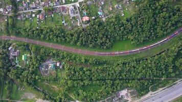 Drone view of a moving freight train in the suburbs of Vladivostok video