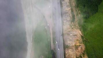 View from the drone vertically down to the seashore with highway video