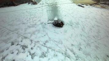 Drone view of the frozen sea overlooking a small island in the middle video