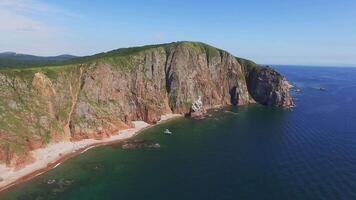View from a drone of the coastline with a rocky coast and high cliffs video