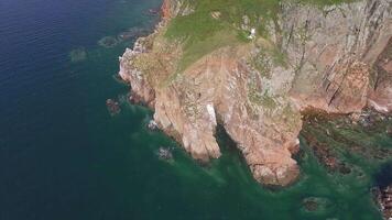 View from a drone of the coastline with a rocky coast island of Shkot video