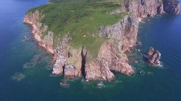 View from a drone of the coastline with a rocky coast island of Shkot video