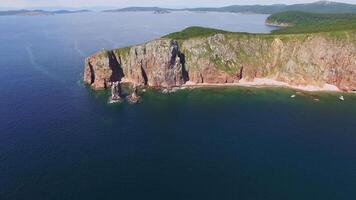 View from a drone of the coastline with a rocky coast island of Shkot video
