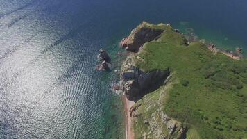View from a drone of the coastline with a rocky coast island of Shkot video