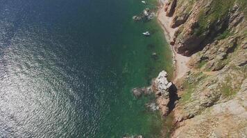 View from a drone of the coastline with a rocky coast and hight cliffs video