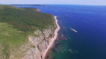 View from a drone of the coastline with a rocky coast island of Shkot video