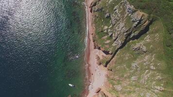 View from a drone of the coastline with a rocky coast and hight cliffs video
