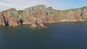 View from a drone of the coastline with a rocky coast and hight cliffs video