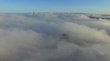 View from a drone of the bridge the fog that spreads over the ground. video