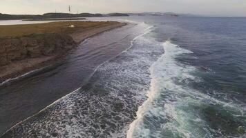 Drone view of the sea coast with rocky shore and waves video