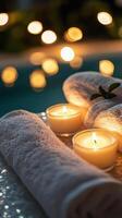 Relaxing ambiance with candles and soft towels in a cozy, well lit space photo