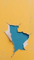 Colorful torn paper background in teal and yellow creating a striking design element photo