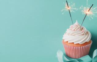 Sparkling cupcake celebration with colorful sprinkles and ribbon on blue background photo