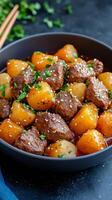 Delicious beef stew with vegetables served in a black bowl at a cozy kitchen setting photo