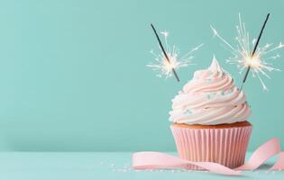 Sparkling cupcake celebration with colorful sprinkles and ribbon on blue background photo