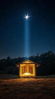 Starry night over a rustic shelter with hay under a glowing light in the countryside photo