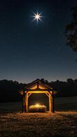 Starry night over a rustic shelter with hay under a glowing light in the countryside photo