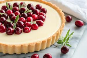 Cranberry tart garnished with fresh herbs during festive season photo