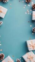 Colorful festive presents arranged on a bright blue background with decorative elements photo